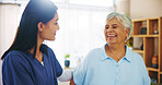 Smile, conversation and old woman in home with nurse for senior care, support and trust in lounge. Homecare, elderly person and caregiver in living room with healthcare advice, bonding and comfort