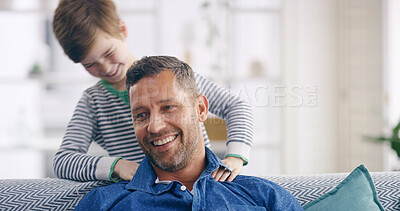 Buy stock photo Boy, father and happy for sofa with massage for shoulder, injury and bonding with care in home living room. Child, dad and helping for pain, stress or muscle cramp with smile on couch in family house
