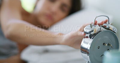Buy stock photo Woman, hands and snooze alarm clock in bed for noise alert, wake up and stop timer in home. Early morning, tired person and press watch in bedroom to start day, resting and sunrise by bedside table