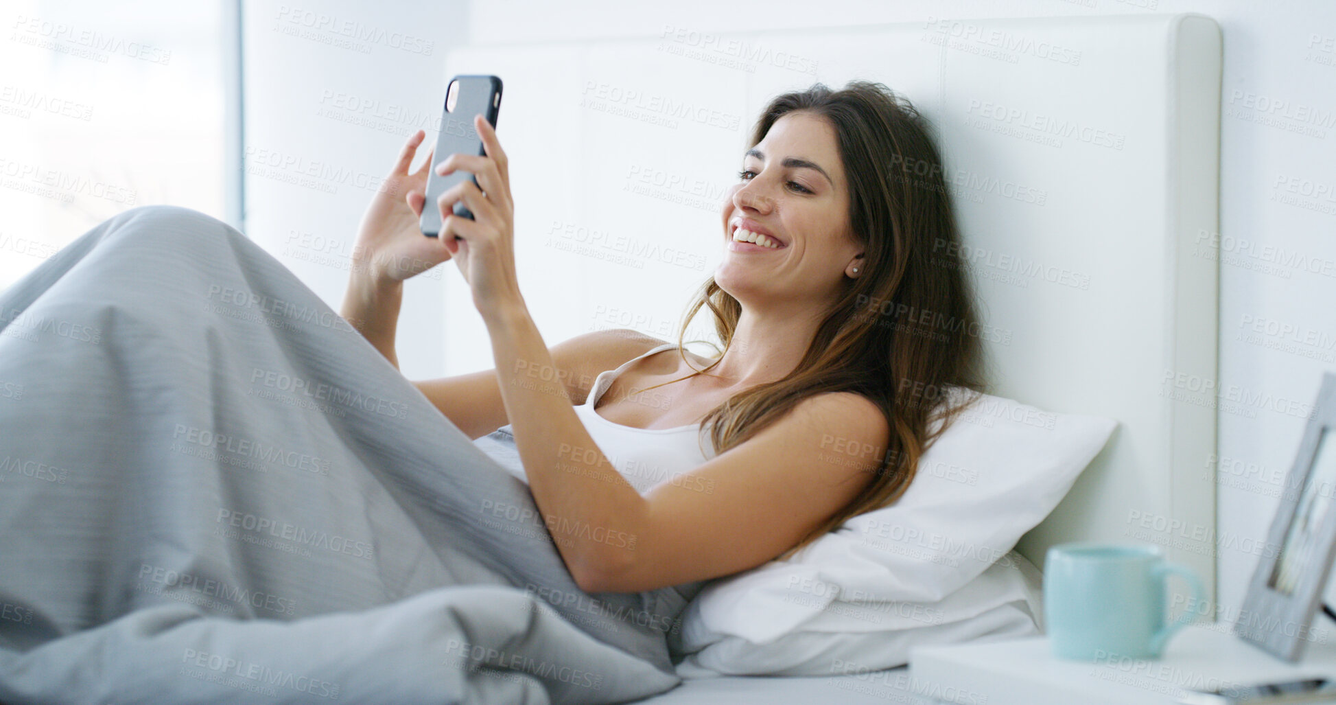 Buy stock photo House, bedroom and woman with smartphone, smile and check email with online chatting. Person, apartment and girl with cellphone, message to contact and texting with digital app and mobile user