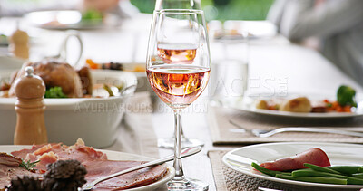 Buy stock photo Wine glass, dinner and table with food at restaurant party, social event and celebration at gathering. Alcohol drink, catering service and meal on plate, meat and vegetables for lunch or fine dining