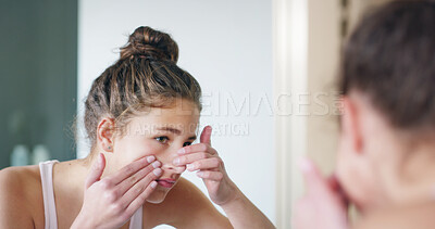 Buy stock photo Girl, pimple and skincare in mirror, bathroom and check for zit, acne and morning routine at family home. Teenager, face and dermatology with reflection, cosmetics or insecure for beauty at apartment