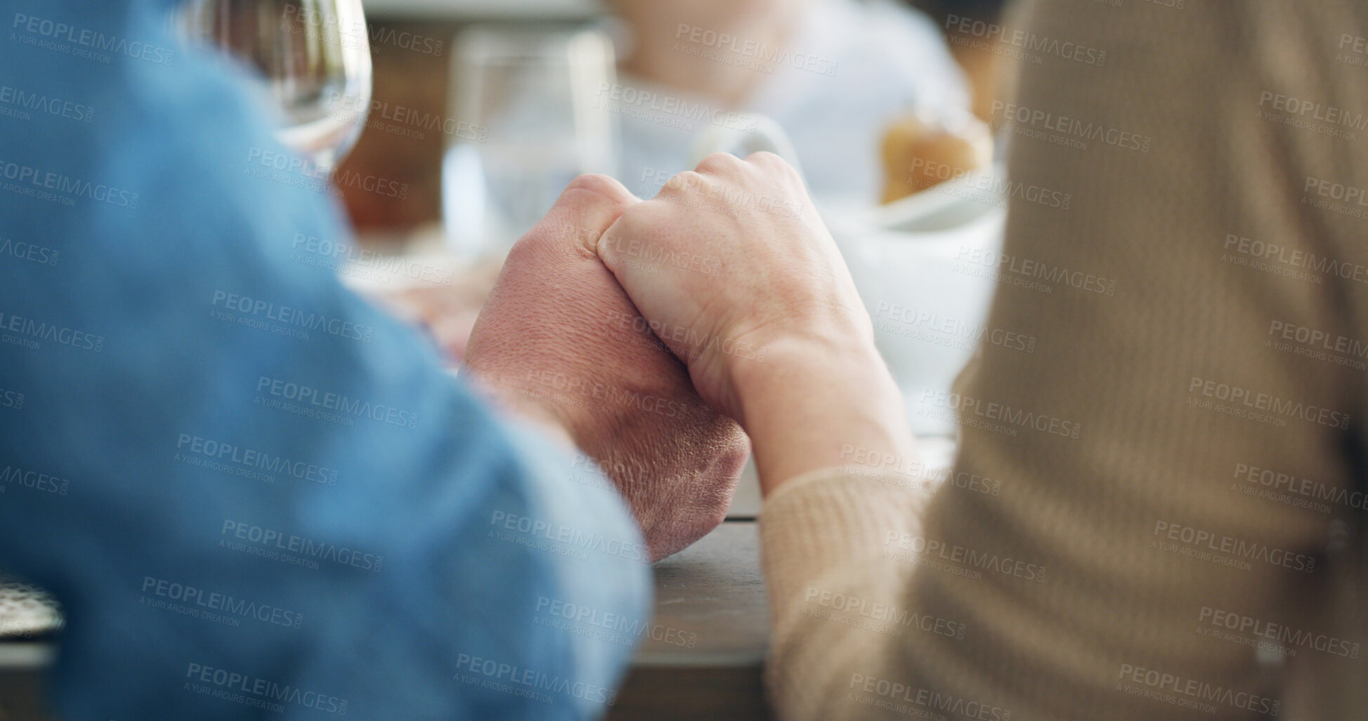 Buy stock photo Holding hands, lunch and praying with family at table in dining room of home together for religion. Belief, grace and thanks with group of people eating meal in apartment for holiday or vacation