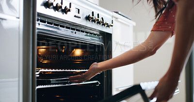 Buy stock photo Woman, hands and oven in kitchen for baking, recipe process and tray on rack in home. Female person, electric equipment and cooking at stove for meal prep, diet care and nutrition in homemade food