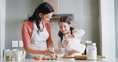 Buy stock photo Mother, child and baking with milk, kitchen and learning with ingredients for pastry or dessert or bread. Happy, woman and daughter help teaching for cooking pudding, cake or bakery recipe in house
