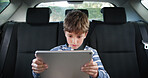 Road trip, child and play with tablet, games or online movie for entertainment and vacation. Boy, vehicle and scrolling on social media, holiday cartoons and adventure or journey with technology
