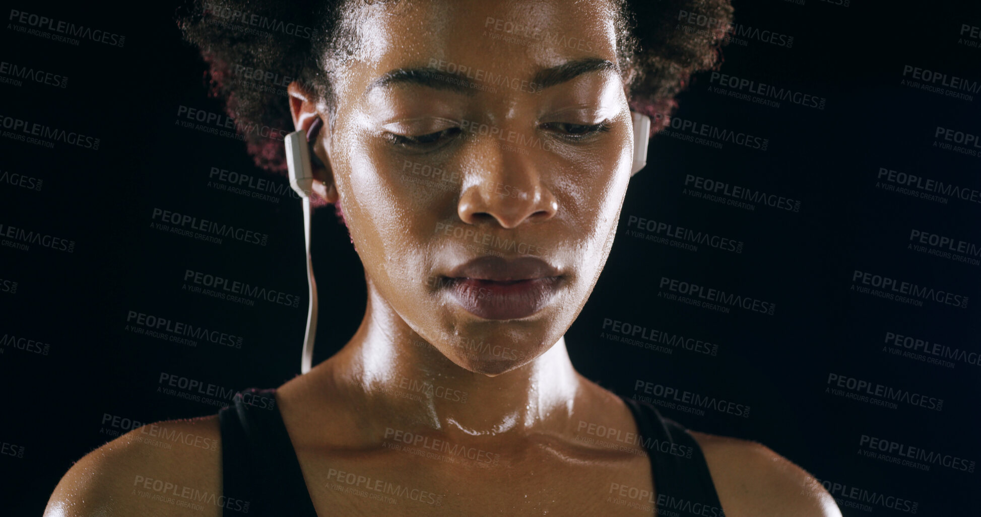 Buy stock photo Earphones, fitness and black woman rest in studio for intense training, exercise and workout. Sports, lens flare and person sweating for wellness, health and listening to music on dark background