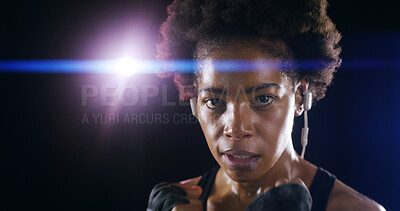 Buy stock photo Woman, boxer fighter and studio for workout, sweating and lens flare on black background. African person, performance training and strong power with martial arts, portrait and sport song on earphones