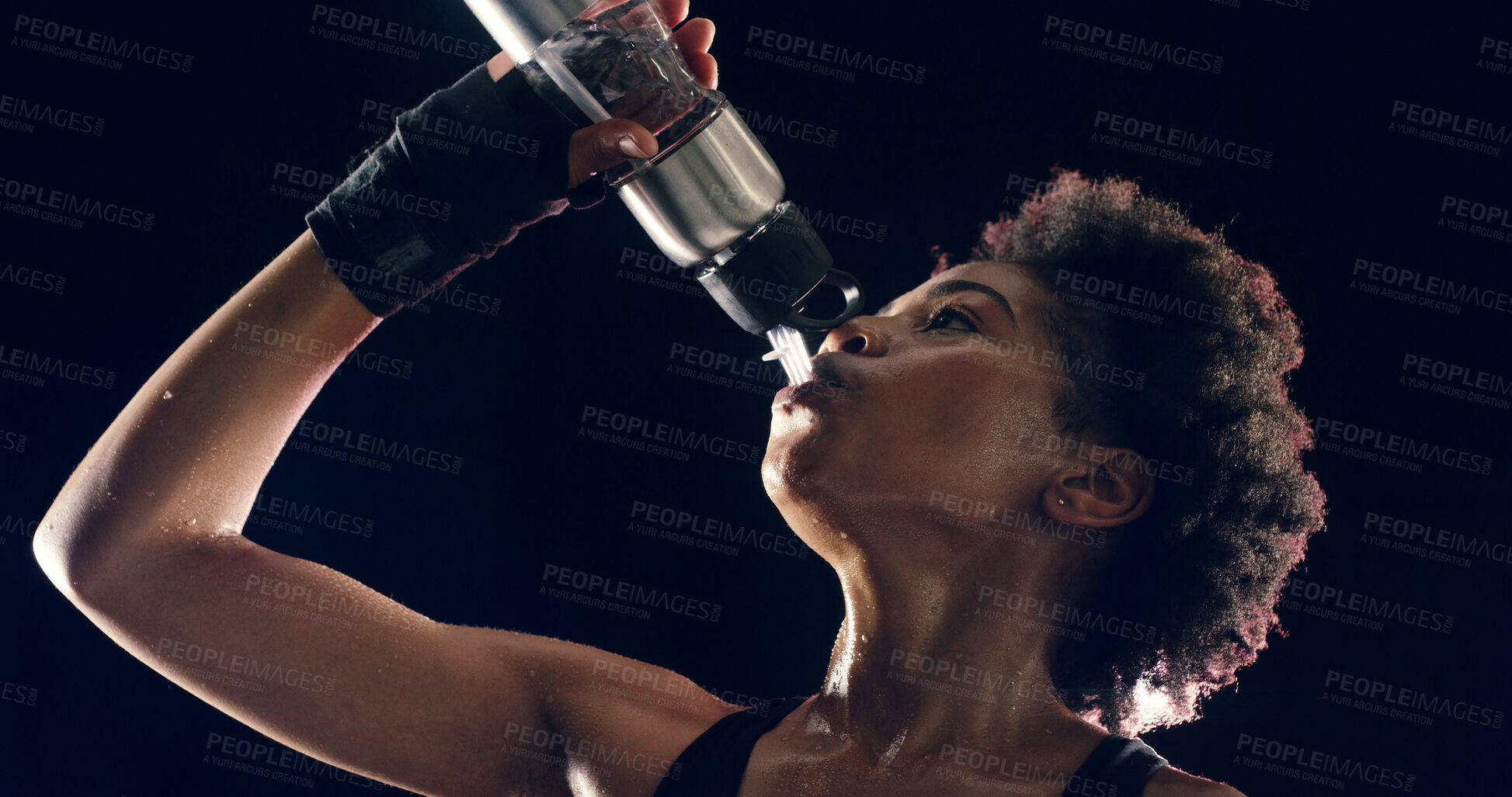 Buy stock photo Fitness, drinking water and black woman in studio for training, exercise and cardio workout. Sports, dark background and person with bottle for hydration sweat for wellness, health and performance