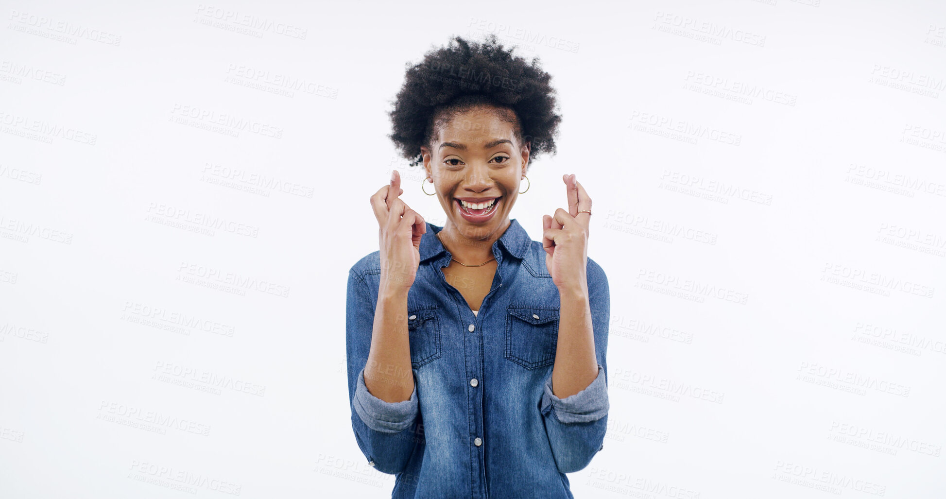 Buy stock photo Fingers crossed, portrait and smile of black woman in studio on white background for hope, luck or wish. Competition, emoji and superstition with happy person waiting for lottery news or result