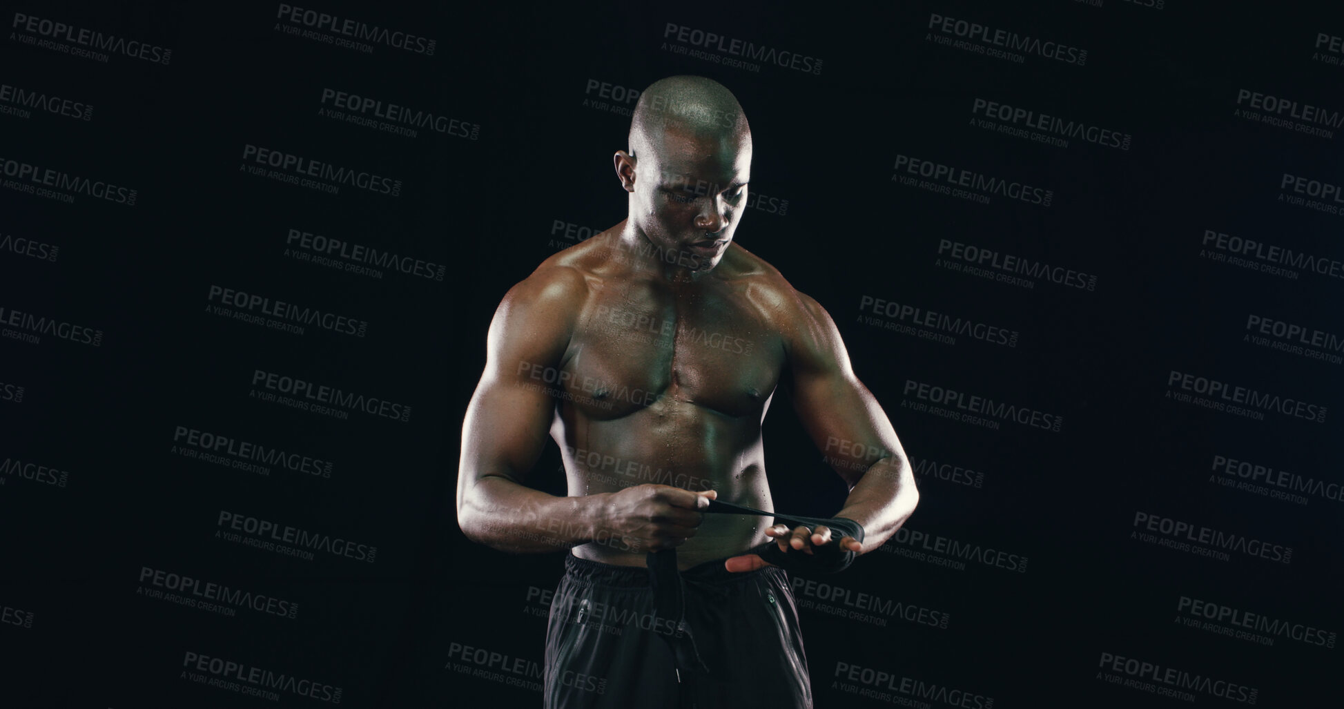 Buy stock photo Body, fitness and wrapping with black man in studio for combat sports or martial arts preparation. Exercise, getting ready and start of training with shirtless athlete or fighter on dark background