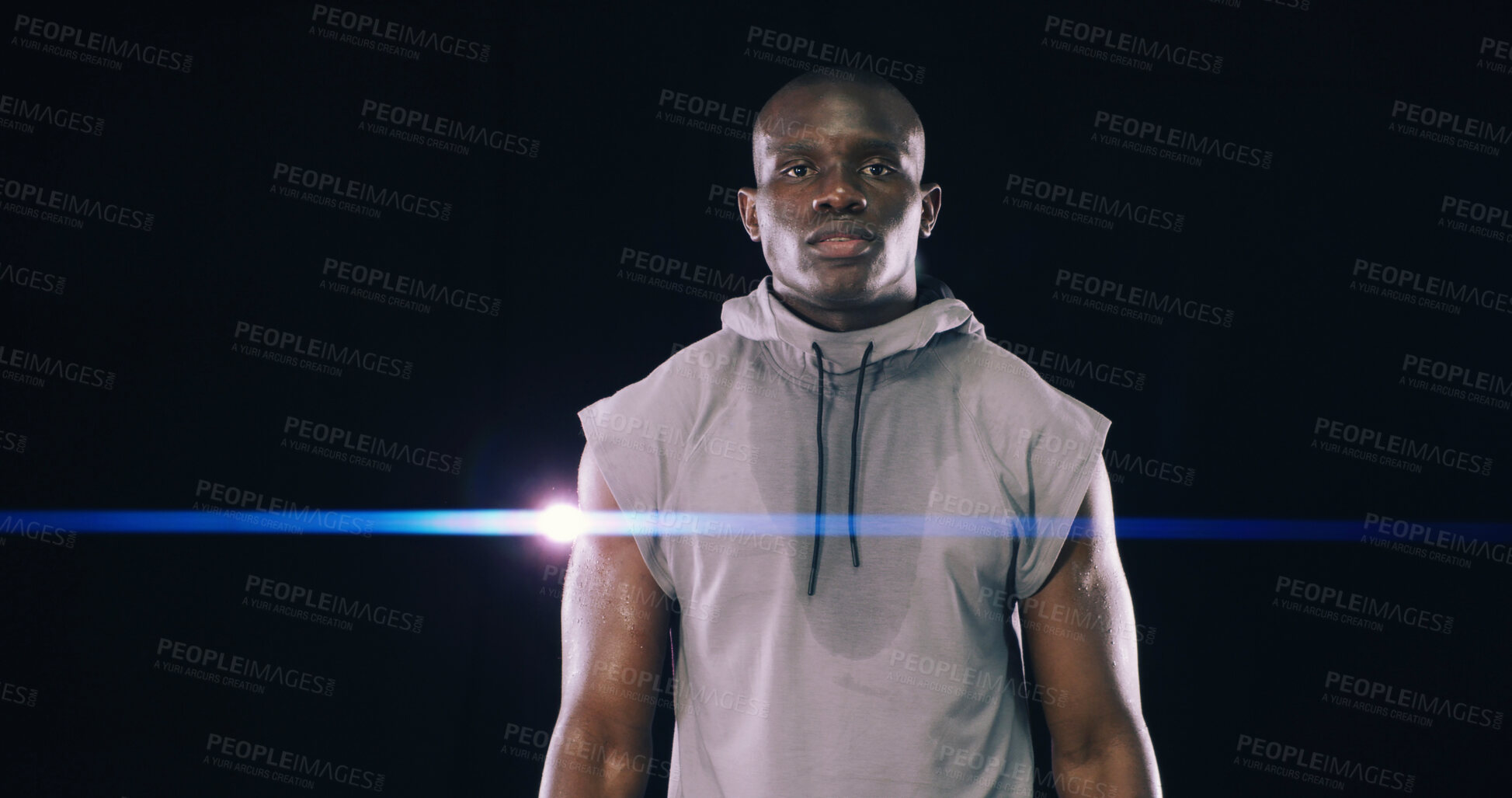 Buy stock photo Portrait, black man and hoodie of fitness in studio of bodybuilding, strength workout and growth results. Athlete, lens flare and pride of competition, boxing training and wellness on dark background