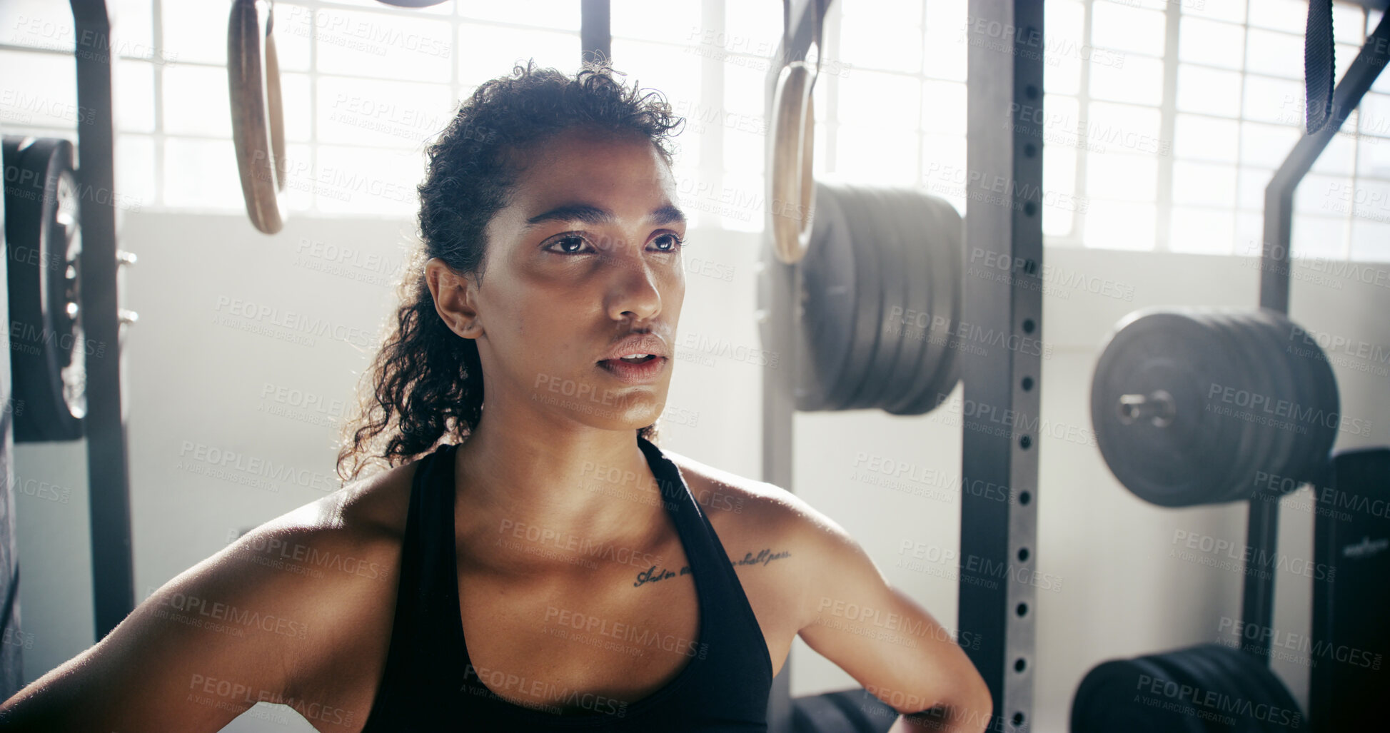 Buy stock photo Tired, woman and thinking in gym for fitness, catching breath or training at weightlifting equipment. Female athlete, sweat or fatigue in sports center with commitment, mindset or ready for exercise