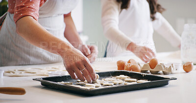 Buy stock photo Hands, baking and mother with child in kitchen with dough for learning with cookies or biscuits. Tray, eggs and mom teaching girl kid to cook with ingredients and utensils for dessert in home.