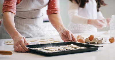 Buy stock photo Hands, baking and mother with kid in kitchen with dough for learning with cookies or biscuits. Tray, eggs and mom teaching girl child to cook with ingredients and utensils for dessert in home.