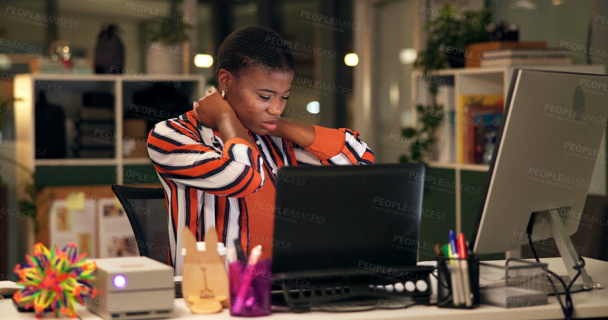 Buy stock photo Black woman, night and neck pain with injury or computer for bad posture, sprain or pressure at office desk. African, female person or employee with strain or muscle tension for fatigue or overworked