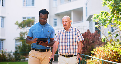 Buy stock photo Caregiver, outdoor and tablet with old man and walker for rehabilitation, healthcare report or support plan. Medical, advice and nurse with person with a disability in nursing home for elderly care