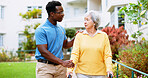 Nurse, outdoor and advice with old woman and walker for rehabilitation, healthcare or helping. Medical, support and caregiver with person with a disability in nursing home for elderly care and trust