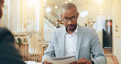 Buy stock photo Black businessman, paperwork and meeting for job interview, assessment and discussion as employee. Male person, document and opportunity for onboarding, recruitment and human resources as hiring team