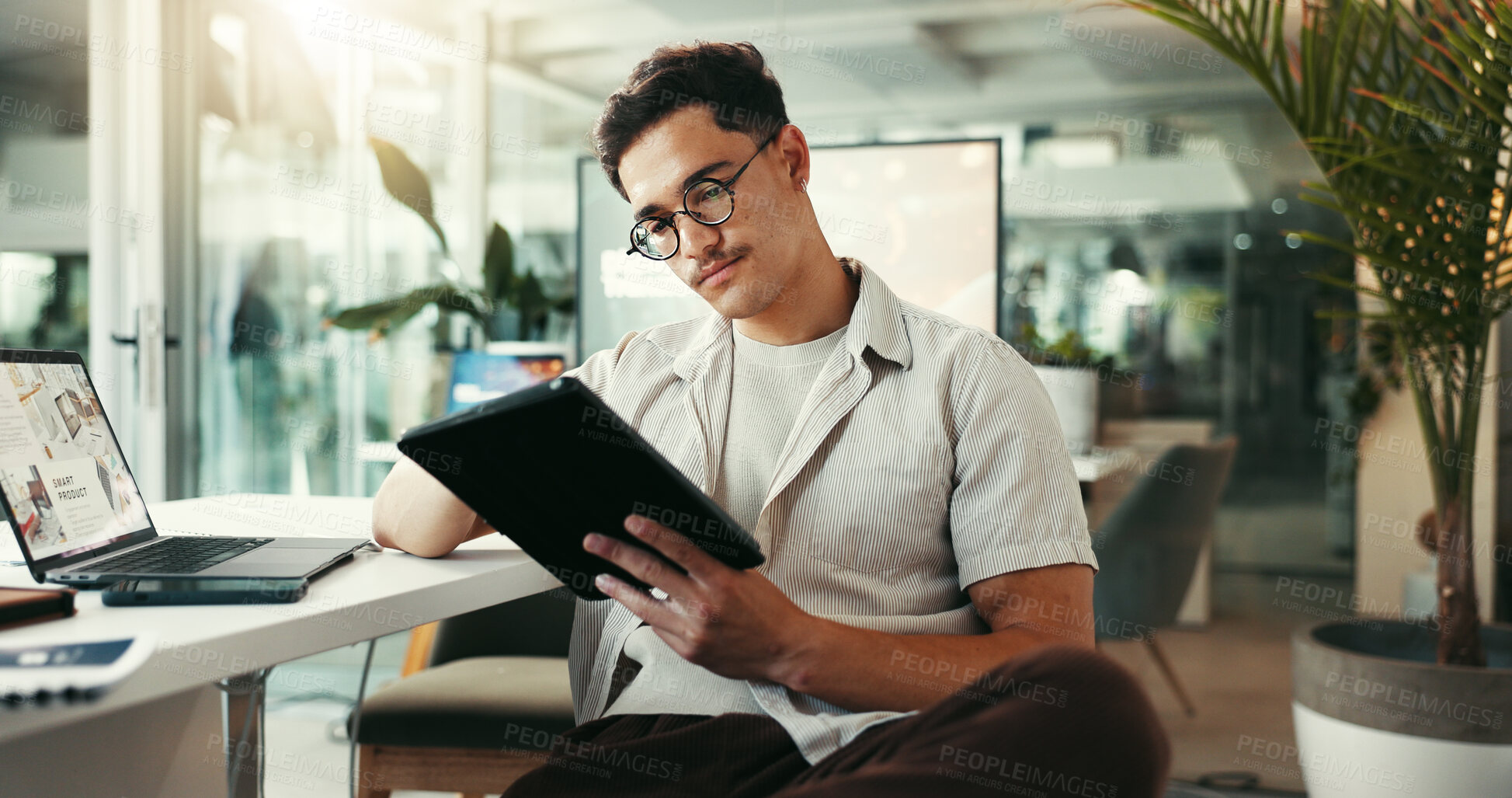 Buy stock photo Serious, browsing and man with tablet, office and research for project on social media and content creator. Online, creative and person with website for competition analysis, influencer and planning
