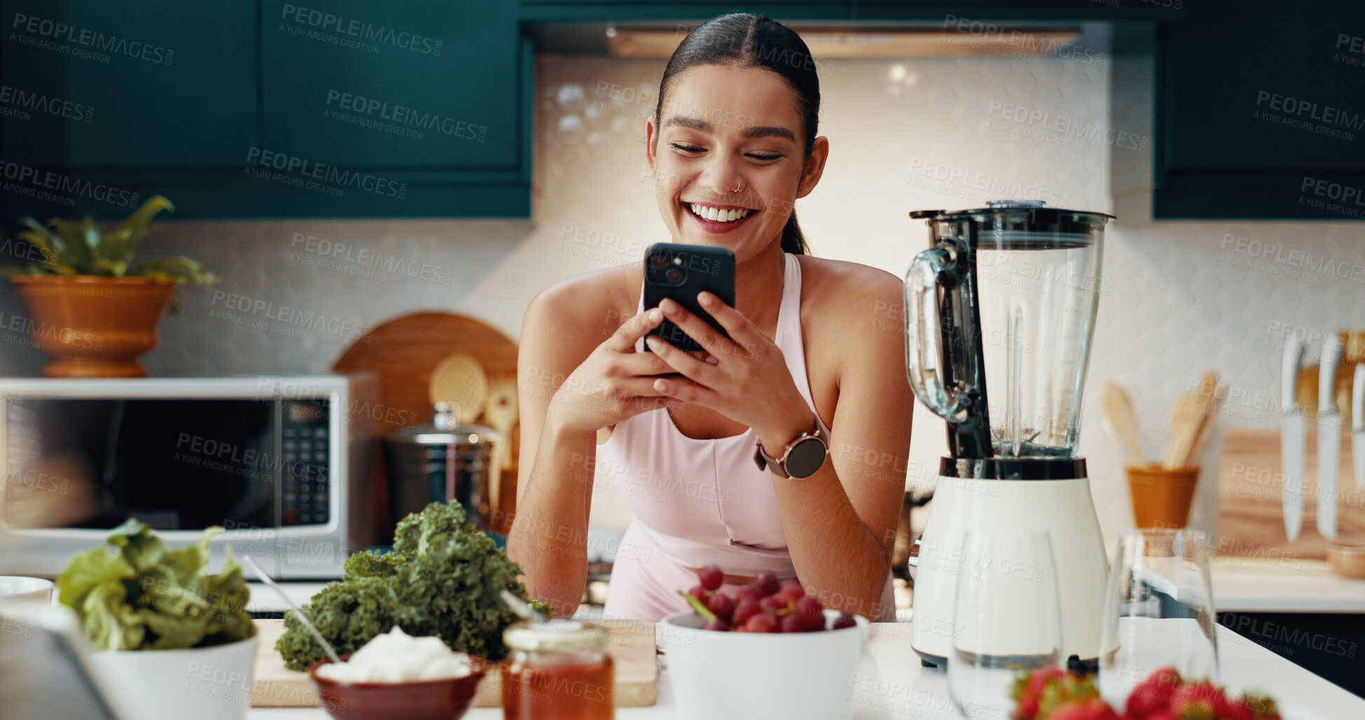 Buy stock photo Cellphone, recipe and woman with smoothie in kitchen for health, wellness and diet breakfast. Happy, phone and female person with vegetables and fruit for nutrition juice in morning at apartment.