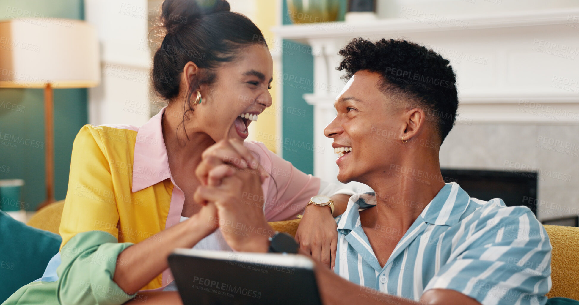 Buy stock photo Excited, holding hands and tablet with couple on sofa in living room of home for bonus or victory. Achievement, celebration or success with man and woman cheering good news of new job together