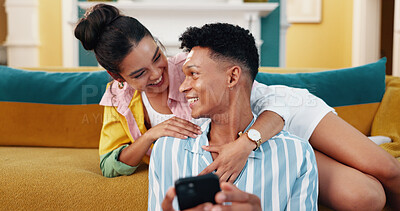 Buy stock photo Happy, phone and couple on sofa in home reading celebrity gossip blog on social media together. Smile, love and young man and woman relax in living room with cellphone for online networking at house.