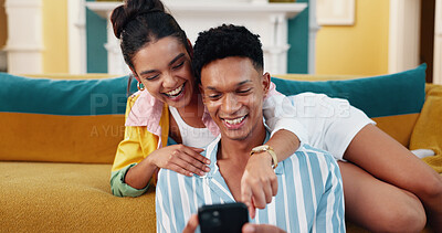 Buy stock photo Couple, sofa and phone with smile, home date and happy for web blog, movie or funny meme in living room. Man, woman and digital technology with comic laugh for social media post and bonding in lounge