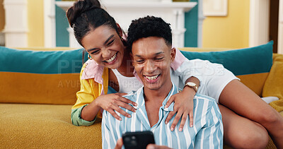 Buy stock photo Couple, couch and phone with smile, home date and happy for web blog, movie or funny meme in living room. Man, woman and digital technology with comic laugh for social media post or bonding in lounge