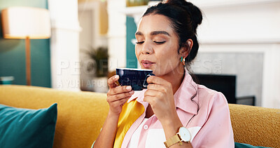 Buy stock photo Woman, cup and blow tea in home, calm living room and drinking cappuccino beverage on couch. Female person, hot chocolate mug and weekend on comfortable sofa, peace and fresh steam in apartment