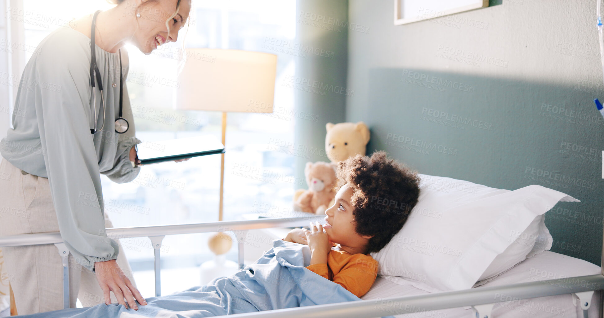 Buy stock photo Hospital, consulting and child in bed with doctor for health, wellness and treatment for rehabilitation. Healthcare, pediatric clinic and woman with boy for medical service, diagnosis and recovery