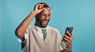 Buy stock photo Bonus, phone and surprise with black man in studio isolated on blue background for alert or announcement. Excited, reaction and wow with winner African person reading text message for promotion