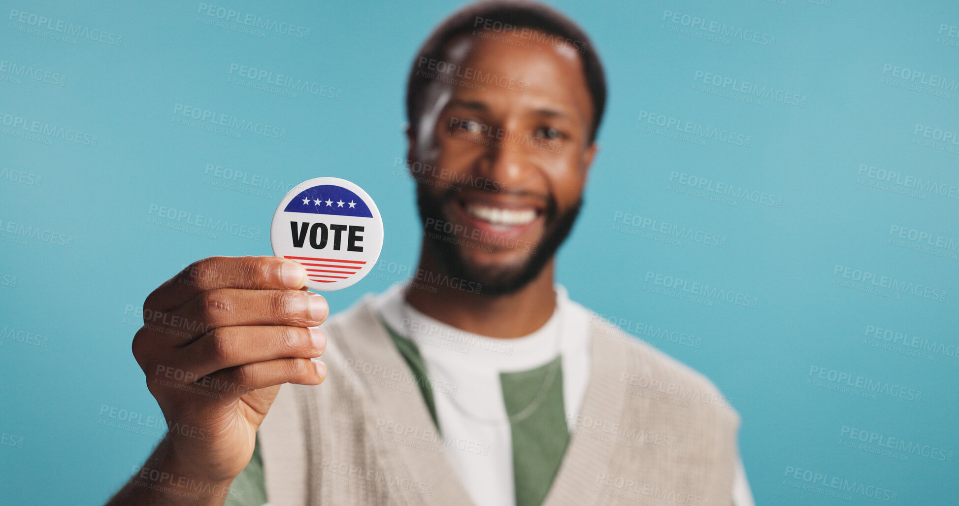 Buy stock photo Black man, vote badge and politics in studio, platform support and message for election registration. Male person, patriotic representative and pin on blue background, campaign volunteer and portrait