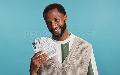 Buy stock photo Portrait, cash fan or black man with prize, gambling profit or wealth in studio on blue background. Dollars, smile or African lottery winner with money pay out, financial freedom or reward with bonus