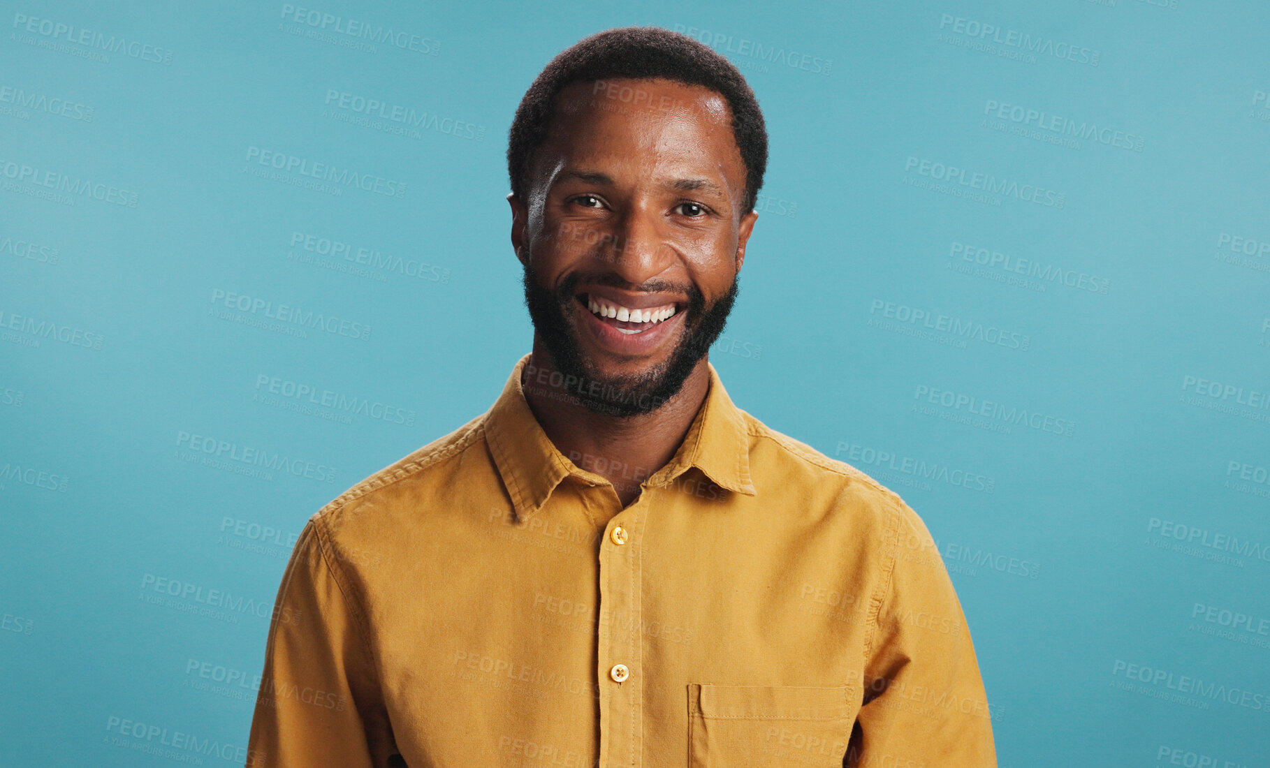 Buy stock photo Happy, portrait and man with smile, studio and positive mindset for career growth, creative and business. Blue background, mockup space and black person with confidence, writer or freelancer in Kenya