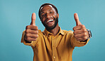 Black man, thumbs up and like emoji in studio, promotion approval and yes icon for agreement. Male person, portrait and thank you for winner motivation on blue background, goals and great feedback
