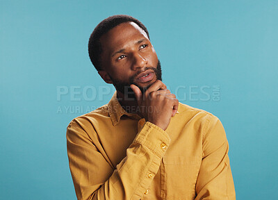 Buy stock photo Black man, thinking and worker for choice in studio, job opportunity and blue background. Male person, professional planning and contemplating decision for startup, reflection and brainstorming ideas