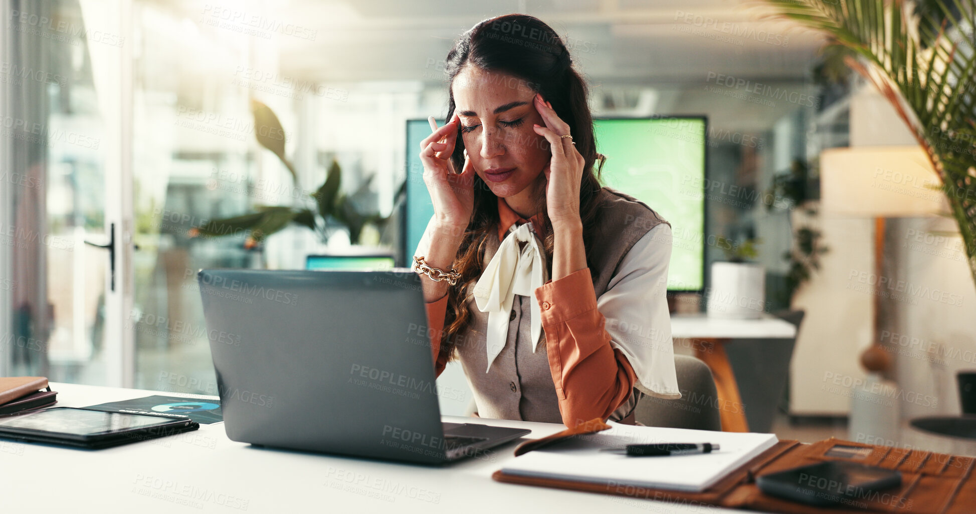 Buy stock photo Woman, laptop and headache in office with stress, creativity burnout and massage temples for relief. Mature designer, migraine and tech in agency with brain fog, tension and overwhelmed with anxiety