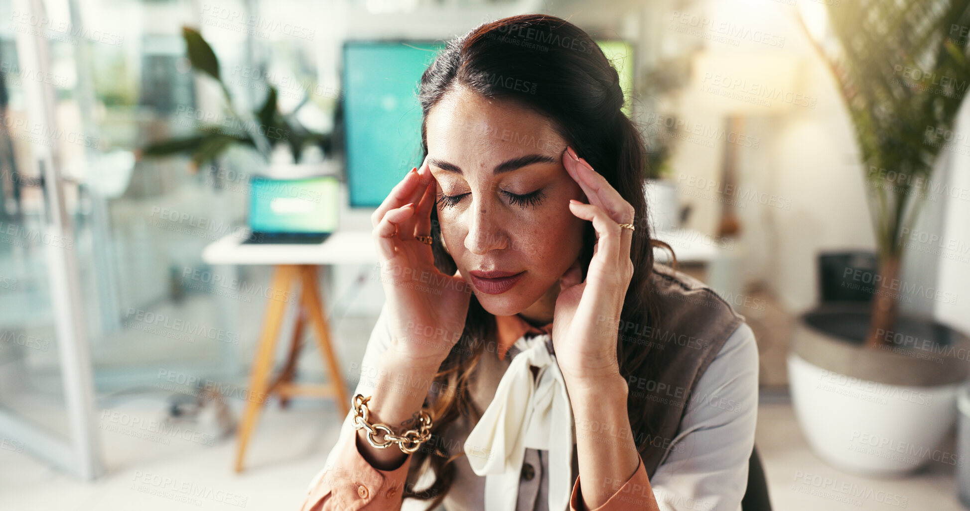 Buy stock photo Woman, business and headache in office with anxiety, creativity burnout and massage temples for relief. Mature designer, migraine or tech in agency with brain fog, tension and overwhelmed with stress