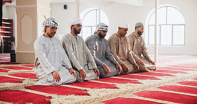 Buy stock photo Mosque, Islam and Muslim men for praying, worship and faith in religious building. Spiritual, Allah and people kneel for Ramadan Kareem blessing, prayer and Islamic belief in Saudi Arabia temple