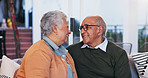 Happy, love and senior couple relaxing in home for bonding, marriage and connection together. Smile, care and elderly man and woman in retirement on sofa with commitment in living room at house.