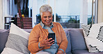 House, typing and old woman on sofa, smartphone and internet with connection in lounge. Pensioner, happy and senior person on couch, mobile user and cellphone for texting, online chatting and contact