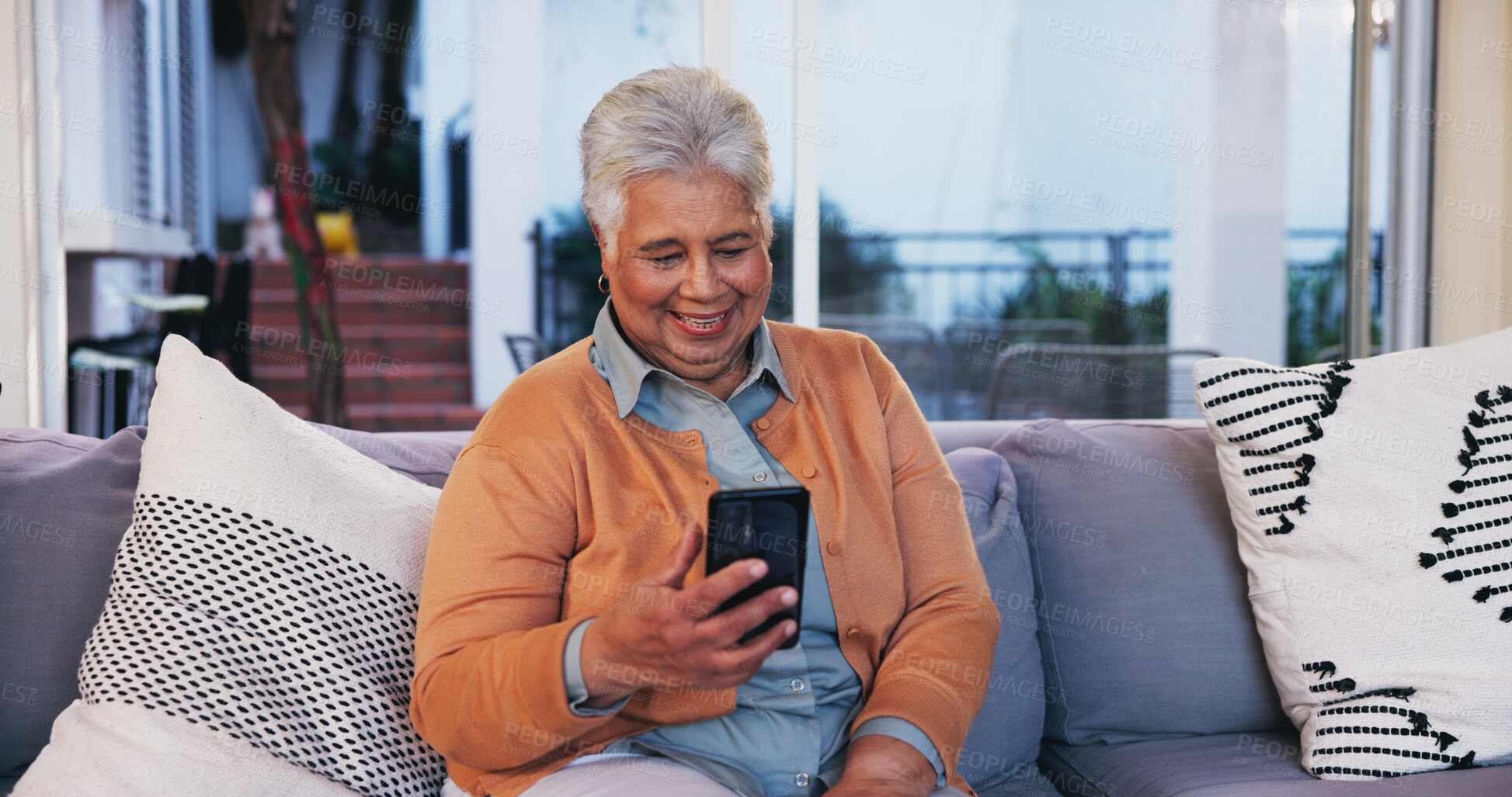 Buy stock photo House, typing and old woman on sofa, smartphone and internet with connection in lounge. Pensioner, happy and senior person on couch, mobile user and cellphone for texting, online chatting and contact