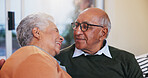 Happy, bonding and senior couple relaxing in home for love, marriage and connection together. Smile, care and elderly man and woman in retirement on sofa with commitment in living room at house.