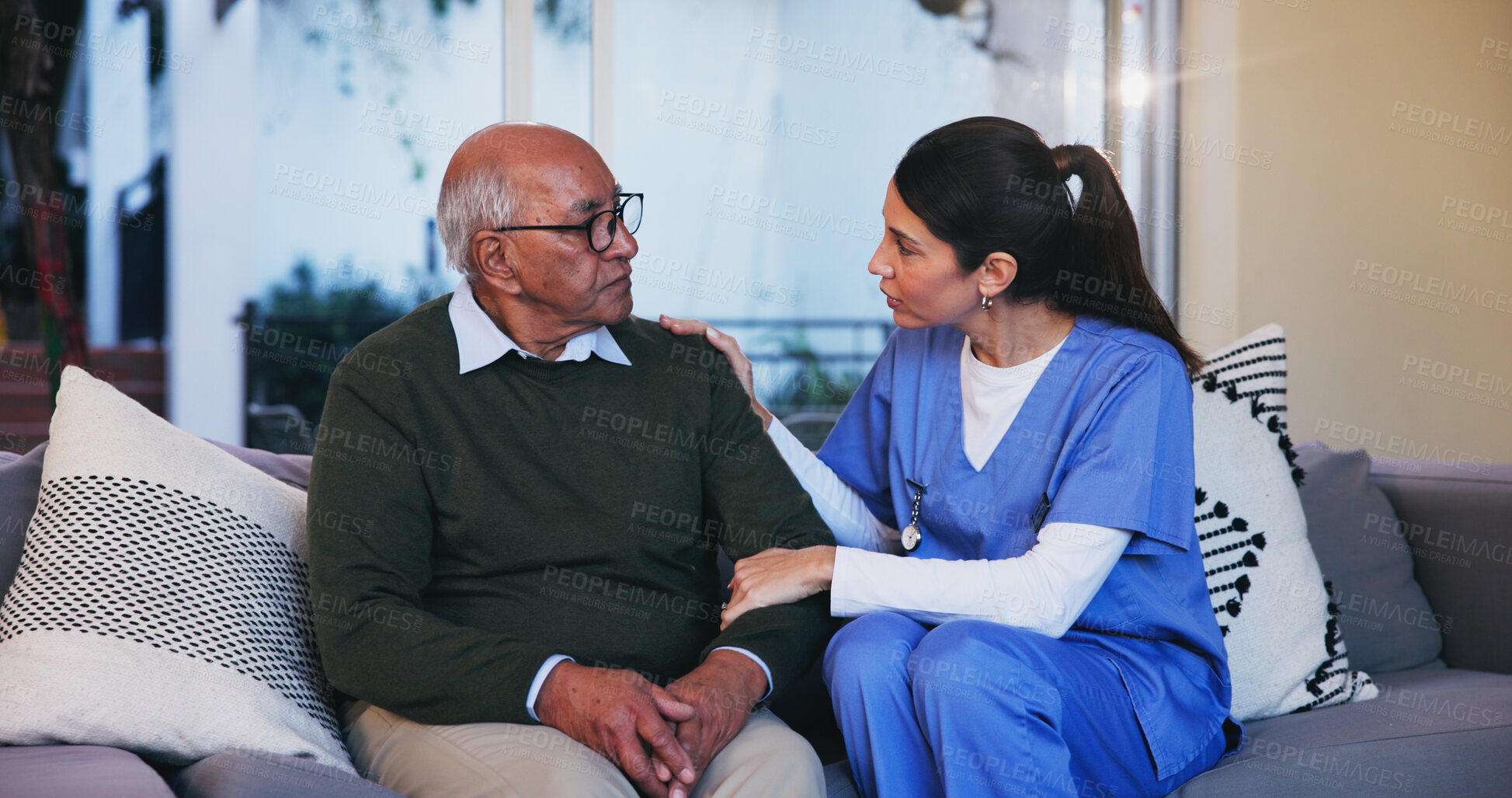 Buy stock photo Senior, man and nurse with conversation on sofa for healthcare support, medical advice and consulting. Retirement home, caregiver and old person on couch with assistance, homecare and health service