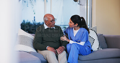 Buy stock photo Senior, man and nurse with conversation in home for healthcare support, medical advice and consulting. Retirement care, caregiver and old person on couch with assistance, discussion or health service