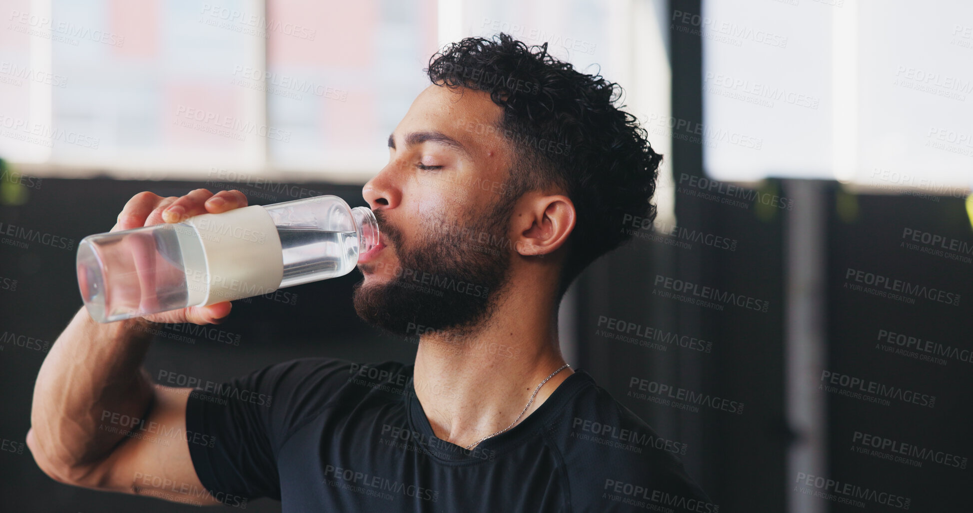 Buy stock photo Break, drinking water and fitness with man in gym for hydration, intense training or workout. Exercise, recovery and rest with athlete person in health club for challenge, performance and progress