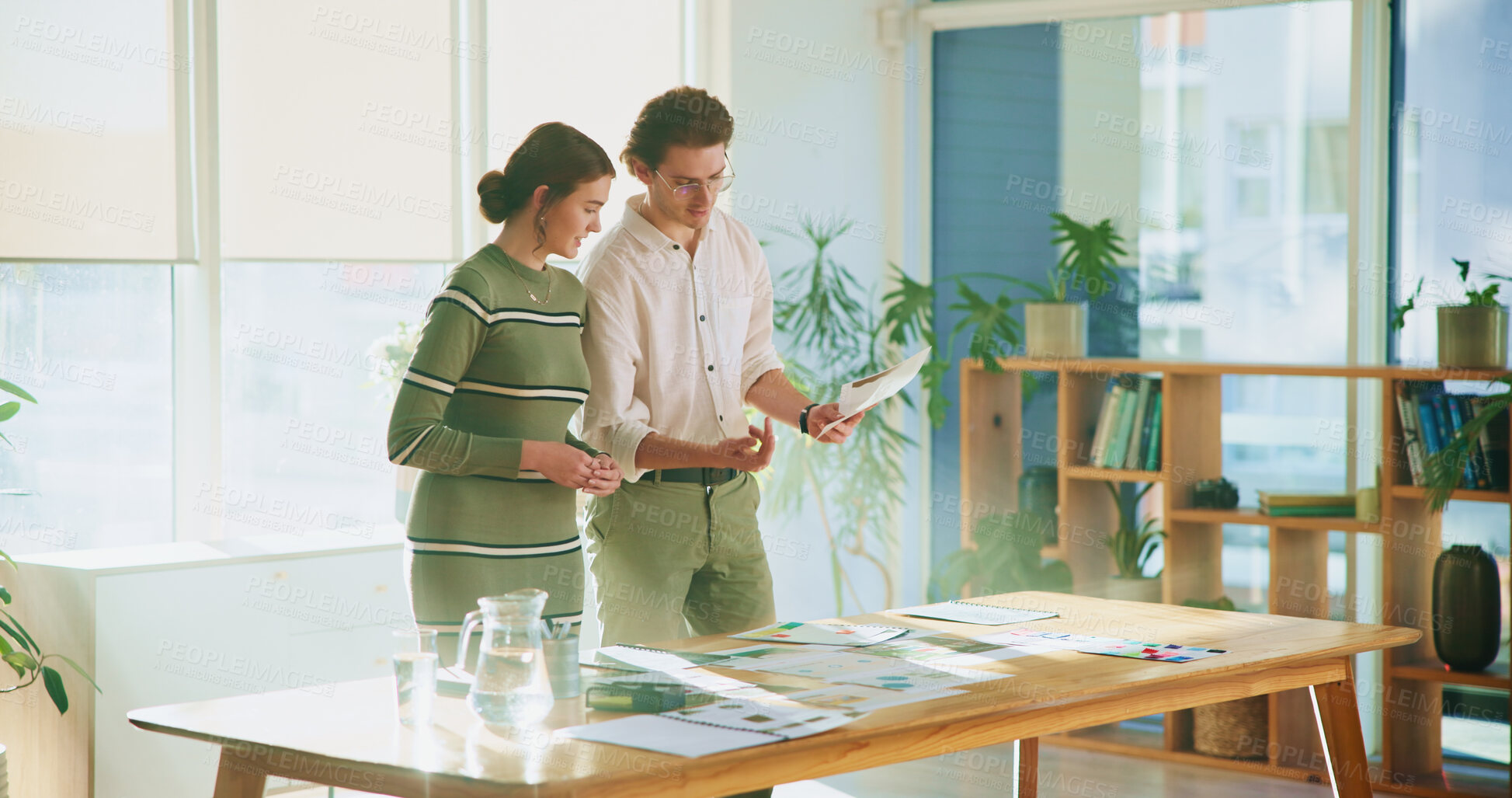 Buy stock photo Collaboration, design and tablet with editing team in creative workplace for discussion or planning. Choice, conversation or magazine with business man and woman in office boardroom for publishing