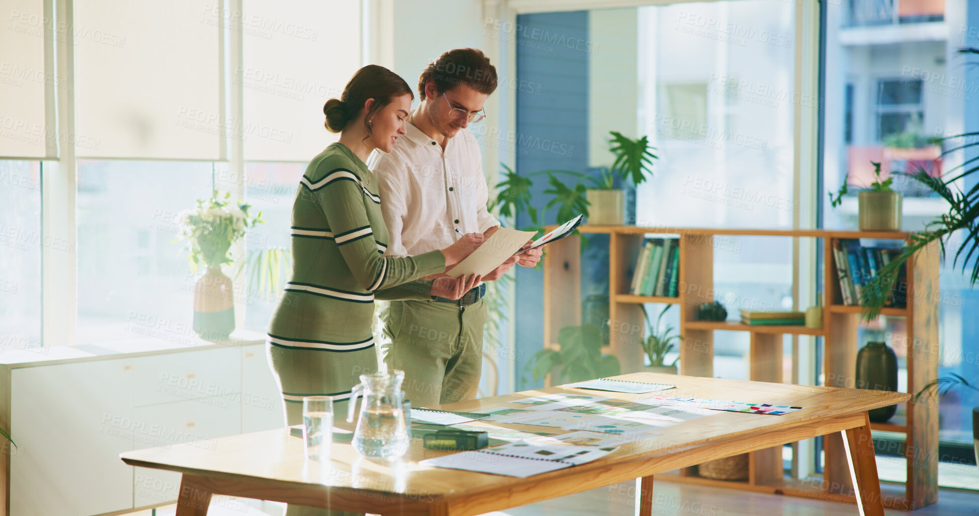 Buy stock photo Design, documents and tablet with editor team in creative workplace for discussion or planning. Collaboration, conversation or magazine with business man and woman in office boardroom for publishing