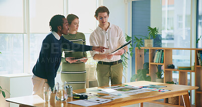 Buy stock photo Collaboration, pointing and tablet with editor team in creative workplace for discussion or planning. Decision, design or magazine with business man and woman in office boardroom for publishing